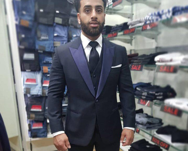 Maitham picking up his 3 piece bespoke suit.