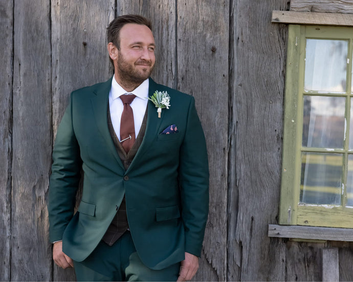 The Groom on the big day with his British green Made to Measure wedding suit!