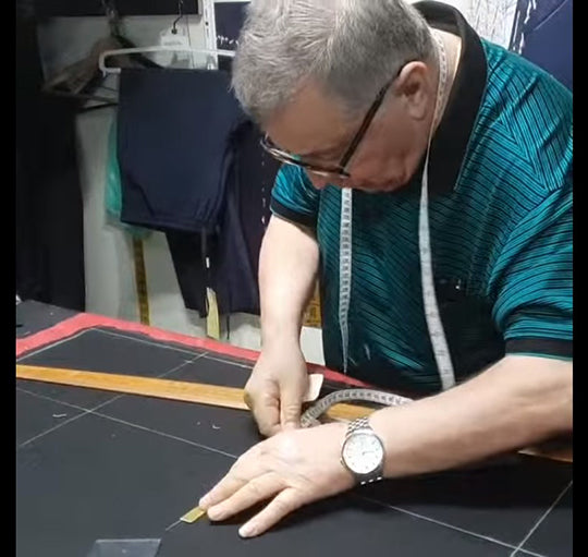 Our maestro marking a new bespoke creation.